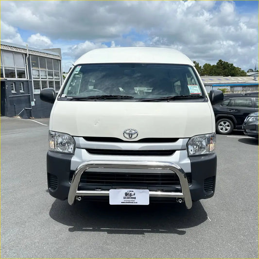White toyota hiace van with chrome bull bar and black front bumper showing off bash plates underbody protection