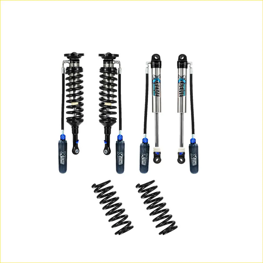 Set of four black and silver x-gear shock absorbers with blue accents and two black coil springs for nissan navara lift kit