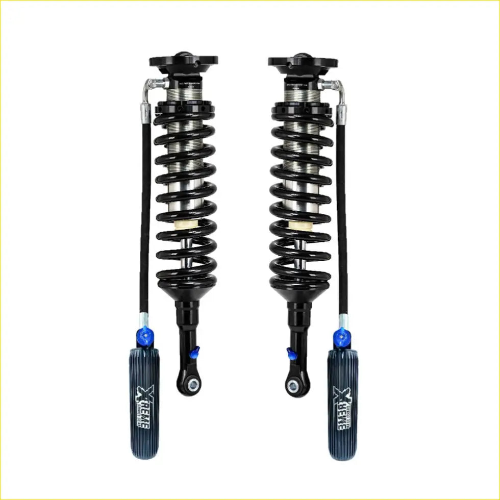 Black and silver x-react coilover shocks with blue adjustment knobs for lift kit towing setups in nz