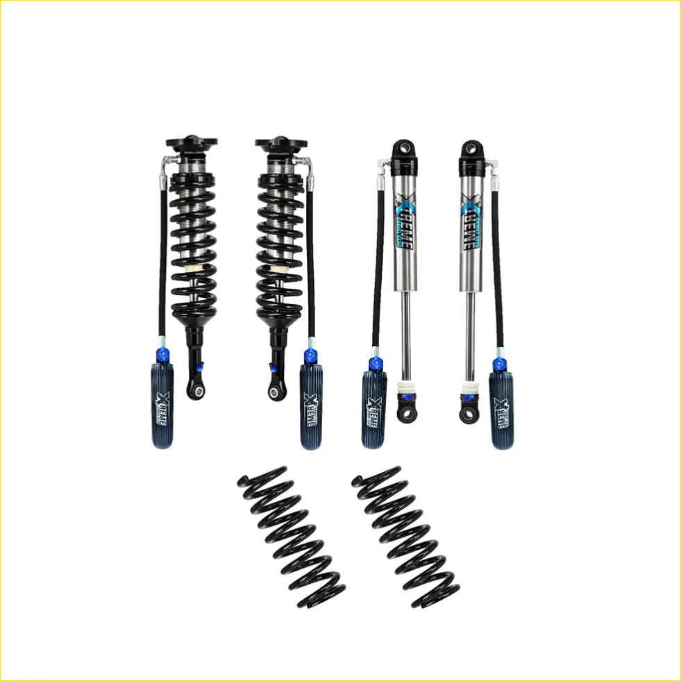 Set of four black and silver xgear shock absorbers with blue accents and two matching black coil springs for lift kits