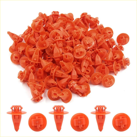 Bright orange plastic wheel flare clip retainers with conical base and interlocking tab heads for toyota cars