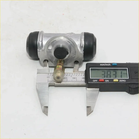 Silver metal 11/16 inch rear wheel brake cylinder with black rubber caps and brass fitting for nissan 720 d21 navara