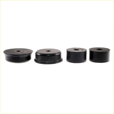 Set of four black rubber mounting bushings with central holes for Nissan Datsun 620 King Cab 1972-1979