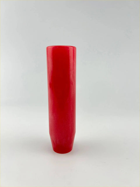 A sleek glossy red metallic resin gear knob with a slightly tapered base measuring 15cm
