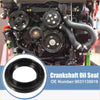 Close-up of black rubberized outer ring and metal inner 2 x engine crankshaft oil seals for toyota rav4 1998-2003 with engine background