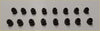 Black silicone earbud tips arranged in two rows alongside 2 head gasket bolts for navara d40 pathfinder murano 2.5 dci y25ddti