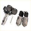 Two silver ignition and door lock cylinder assemblies with black plastic key tops and matching keys for chevrolet silverado 2001