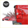 Back side of a red textured ribbed truck bed liner with black mounting hardware for ford ranger tailgate gas strut