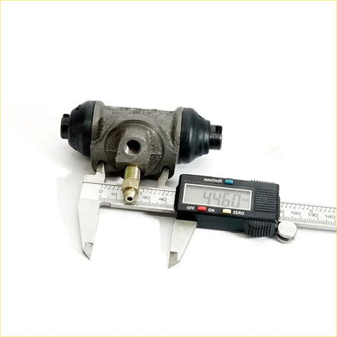 Gray metallic 3/4 rear wheel brake cylinder with black rubber boots and brass fitting for datsun nissan 620 1972-1979