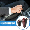 Black leather-wrapped 3 speed automatic transmission shift knob for Toyota Prado with glossy red black textured top and 1-2 marking