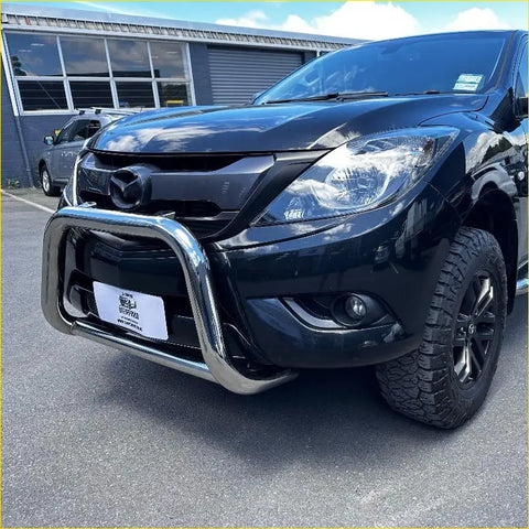 Black mazda bt-50 pickup with a chrome 304 stainless steel nudge bar 2012-2020 front view