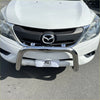 Chrome finished 304 stainless steel nudge bar mounted on a white mazda bt50 2012-2020 front bumper guard