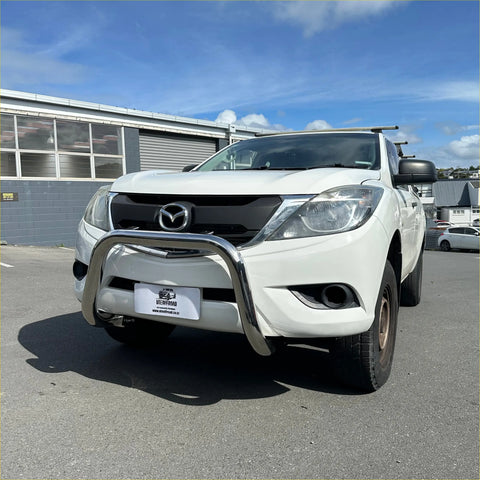 White Mazda BT-50 pickup with 304 stainless steel chrome nudge bar 2012-2020 front view