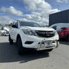 White Mazda BT-50 pickup with a medium size 304 stainless steel chrome nudge bar and roof rack from 2012-2020