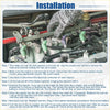 A hand wearing a gray glove holds a metallic fuel rail with green and purple injectors for Toyota Paseo 1.5L