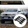 Black plastic exterior door handle covers for toyota tacoma pickups 2016-2023 shown from the back side