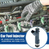 Dark gray plastic fuel injector with silver base and blue o-ring shown close-up with installation on toyota tacoma engine