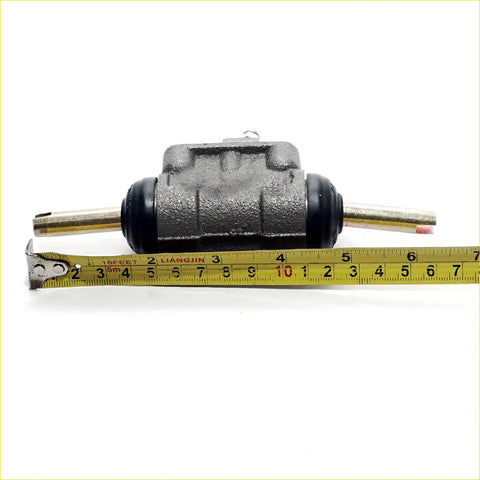 Gray metallic 7/8 rear brake cylinder for toyota hilux 1978-1983 with black rubber seals and brass rods visible