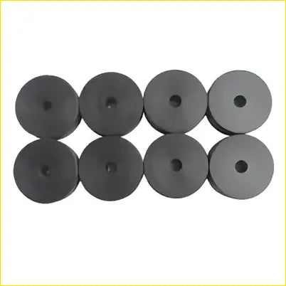 Black circular rubber grommets arranged in two rows for 8x 4wd body lift blocks 1 inch hdpe plastic riser kit ute