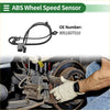 Black abs wheel speed sensor with coiled cable and connector next to mechanic working on toyota venza brake system