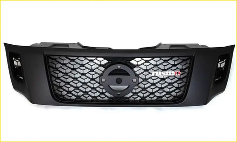Black aftermarket grill for nissan navara nismo with honeycomb mesh pattern and fusion badge on the front grille