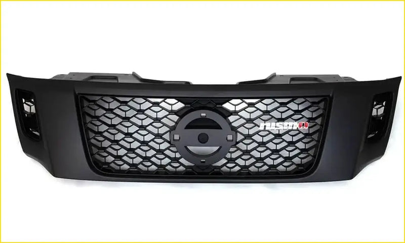 Black aftermarket grill for nissan navara nismo with honeycomb mesh pattern and fusion badge on the front grille