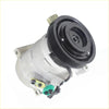 Silver automotive air con compressor with black pulley and colored fittings for chrysler voyager rg 3.3l petrol