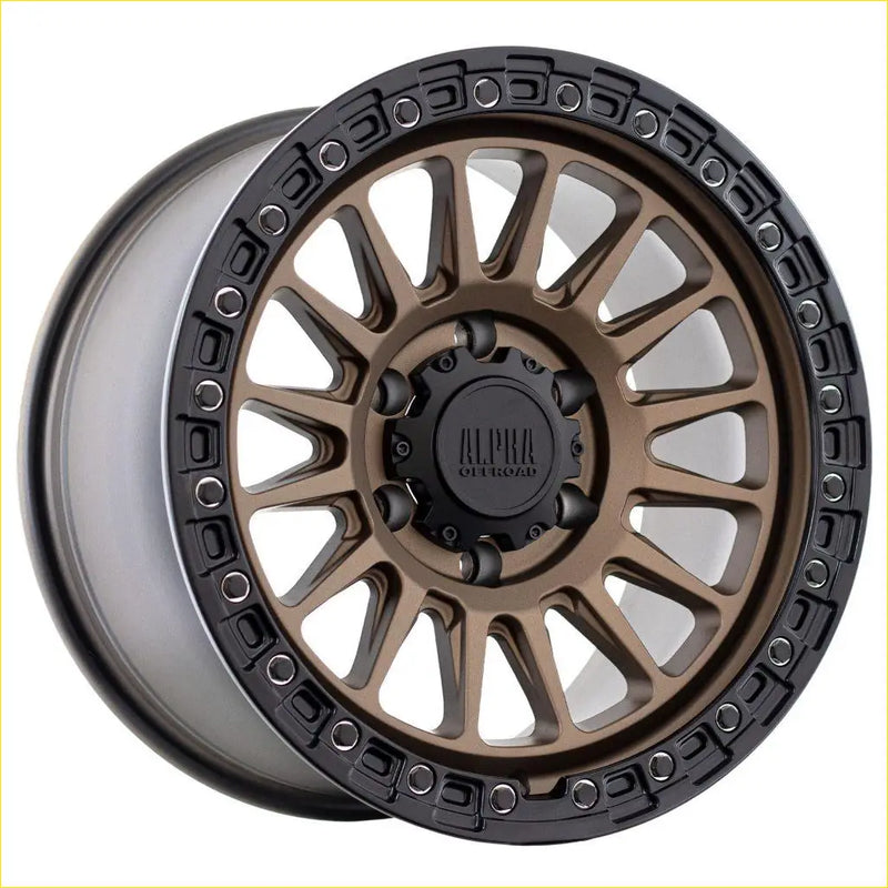 Alpha combat matt bronze with black lip 17x9 alloy wheel with rugged multi-spoke design and alpha outdoors logo center