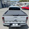 Silver ford ranger wildtrak double cab with black aluminium hard lid diamond plate tonneau cover back side view