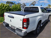 White mitsubishi triton glx-r pickup with black aluminium tri fold hardlid tonneau cover rear view 2015+
