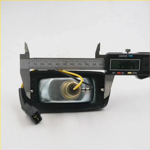 Back of amber side marker light for Nissan Fairlady-Z with black plastic housing silver speaker and yellow wiring measured 39.84 mm