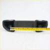 Black textured plastic armrest handle with two curved ends and circular cutouts for mazda bravo b2000 gray model