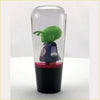 Ball z piccolo kid gear knob featuring green-skinned figurine in clear cylindrical display case with black base and red liquid layer