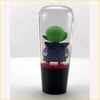 A clear cylindrical glass gear knob with a black base and red accent featuring piccolo kid from ball z in a blue robe