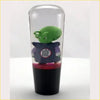 Ball Z Piccolo Kid gear knob clear showing green cartoon character in purple robe inside transparent glass cylinder