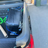 Black plastic toolbox with blue latches and textured lid on pickup bed alongside bedside rail covers 3 piece set for mitsubishi triton 2024+