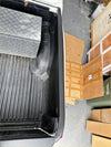 Black rubberized bedside rail covers with ribbed texture and molded edges for nissan navara np300 2015-2020