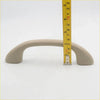 Beige plastic roof grab handle for toyota hilux sr5 2004-2013 with a curved design and smooth surface