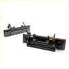 Black plastic door handle set for Toyota Hilux 1983-1997 showing back side with spring mechanism and mounting hardware