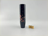 Black cylindrical gear shift knob with pink cherry blossom design for a stylish driving upgrade
