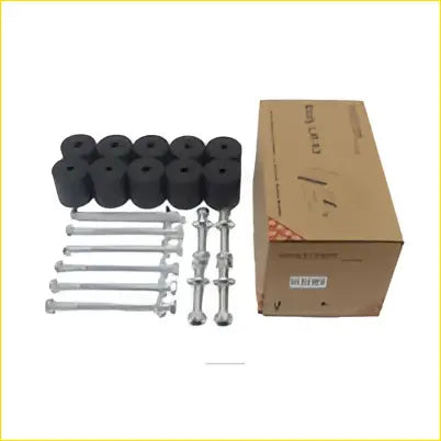 Body lift kit 2 inch showing black rubber tire caps and silver metal lug nuts in a cardboard box for triton dual cab 06-14