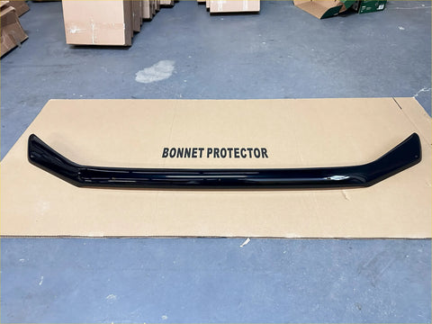 Black glossy plastic bonnet guard protector with sleek curved design for ford ranger 2022+ stone guard