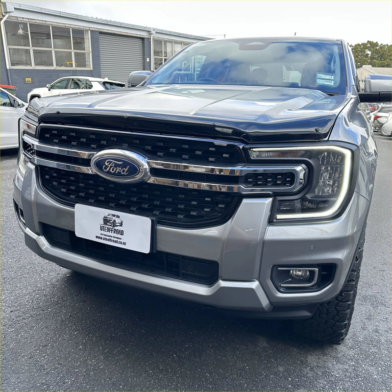 Silver ford ranger 2022 with black grille and chrome accents featuring bonnet guard protector stone guard