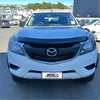White mazda bt-50 pickup truck with black front grille and chrome accents featuring bonnet guard protector stone guard