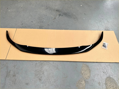 Black glossy plastic bonnet guard protector with a sleek curved design and white stripe for nissan navara np300 2015-2020 oem