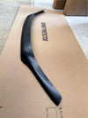 Black glossy plastic rear spoiler shown from the back on a matte black bonnet guard protector stone guard for toyota hilux 2021+