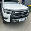 White toyota hilux with matte black bonnet guard protector stone guard and black front bumper guard chrome grille