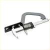 Black and silver digital caliper with sturdy curved handle for precise measurements on bonnet hinge for mazda b series