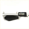 Black plastic guitar pick holder on digital caliper shown with bonnet hinge seals for Toyota Hilux 1988-1997
