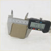 Matte-finished metal bonnet latch with embossed logo being measured by digital caliper for toyota hilux mk7 ute